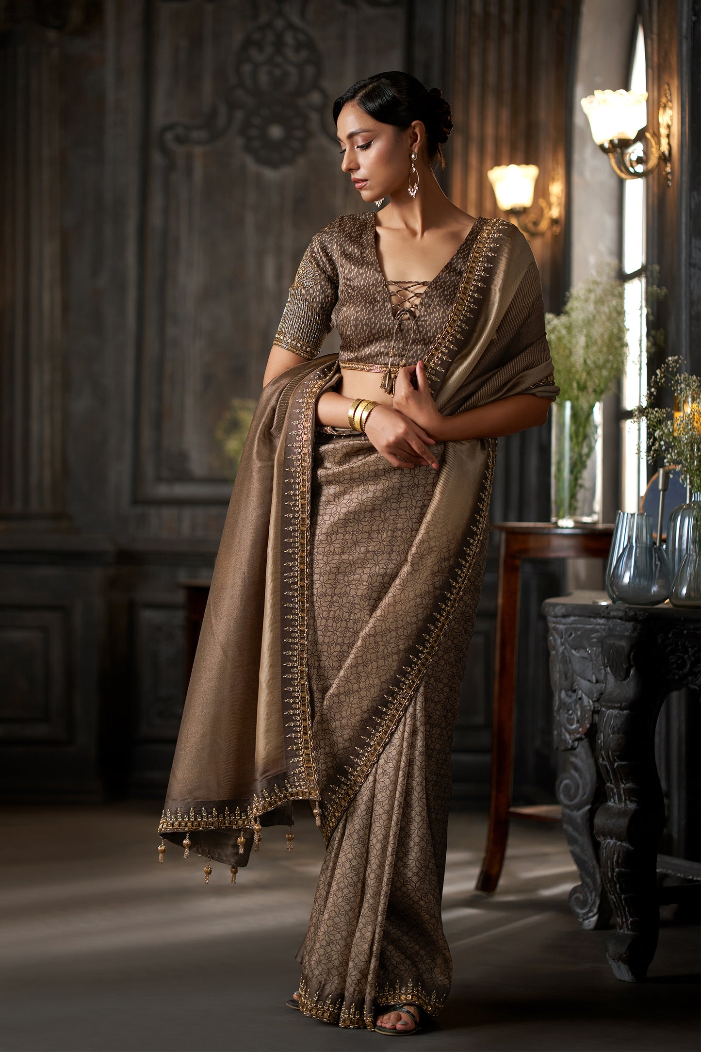 Metallic Embellished Coffee Saree with Intricate Zari Border and heavy sleeve Detailed Blouse