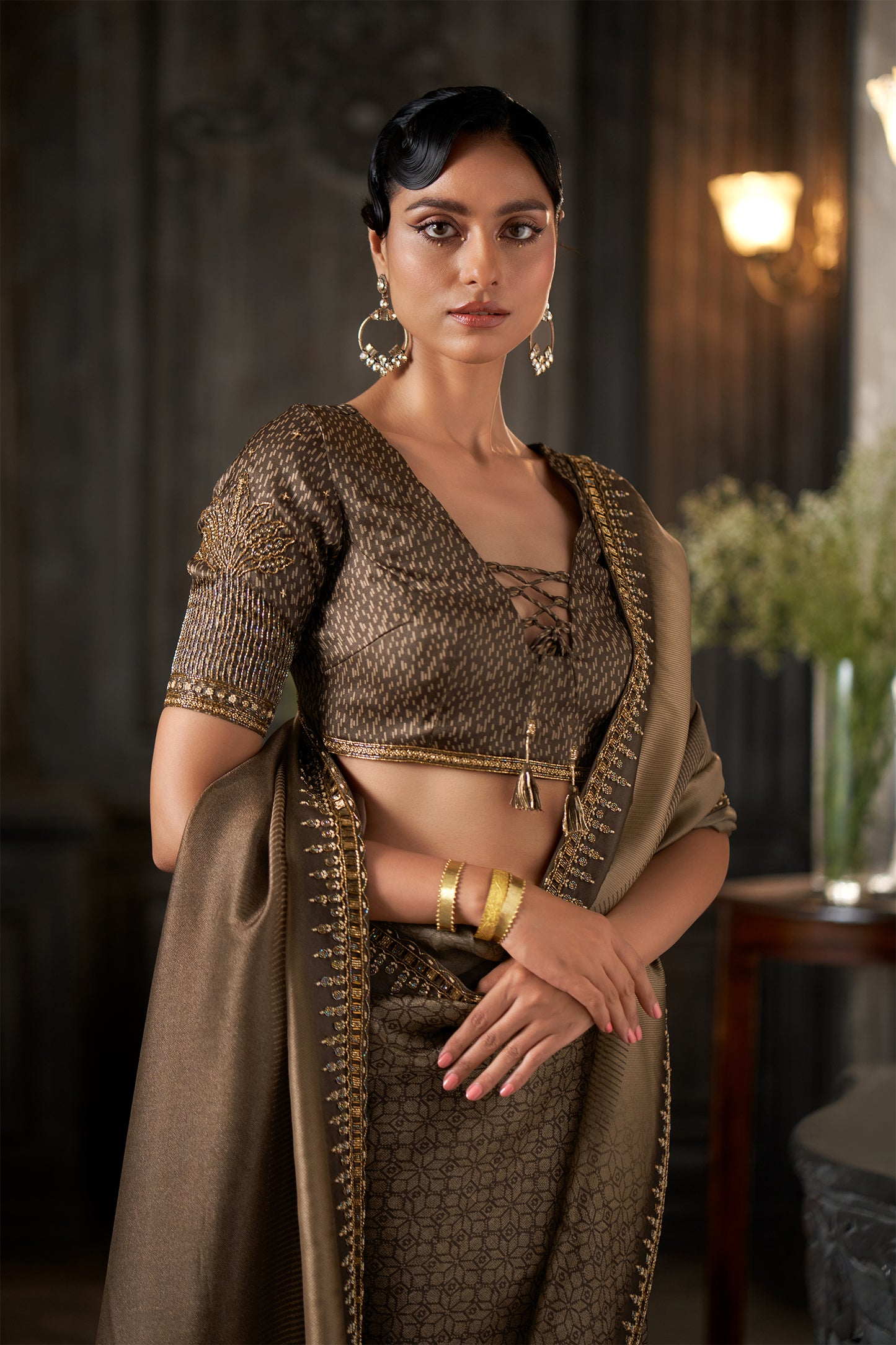 Metallic Embellished Coffee Saree with Intricate Zari Border and heavy sleeve Detailed Blouse
