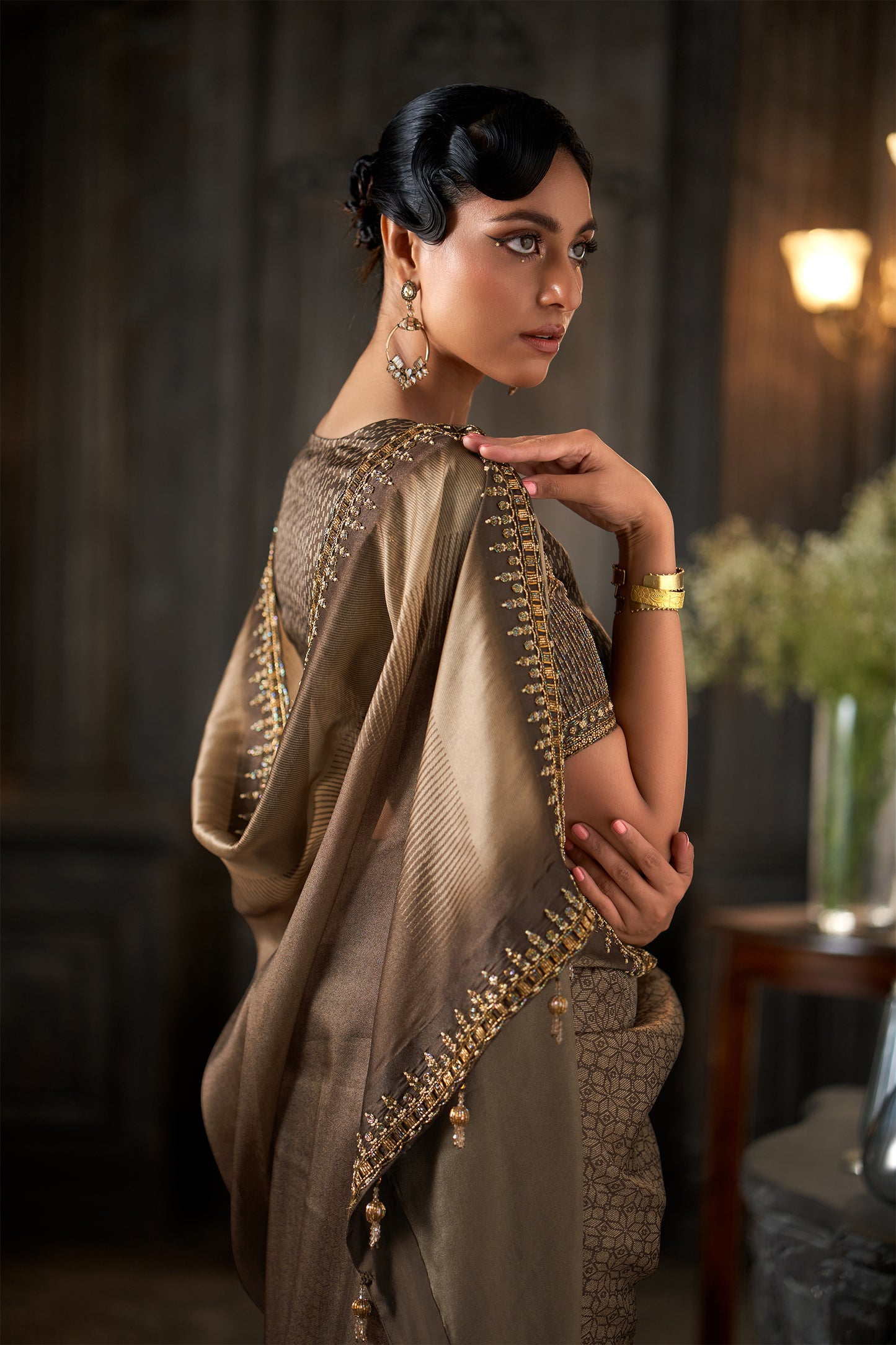 Metallic Embellished Coffee Saree with Intricate Zari Border and heavy sleeve Detailed Blouse